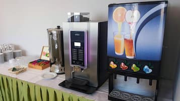 A beverage dispenser with a digital interface and a selection of drink options.