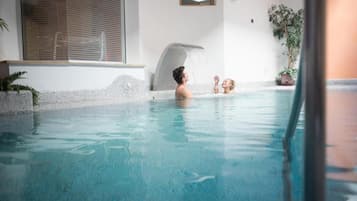 Indoor pool, a waterfall pool, pool loungers