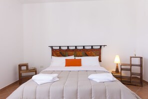 Desk, iron/ironing board, travel cot, bed sheets