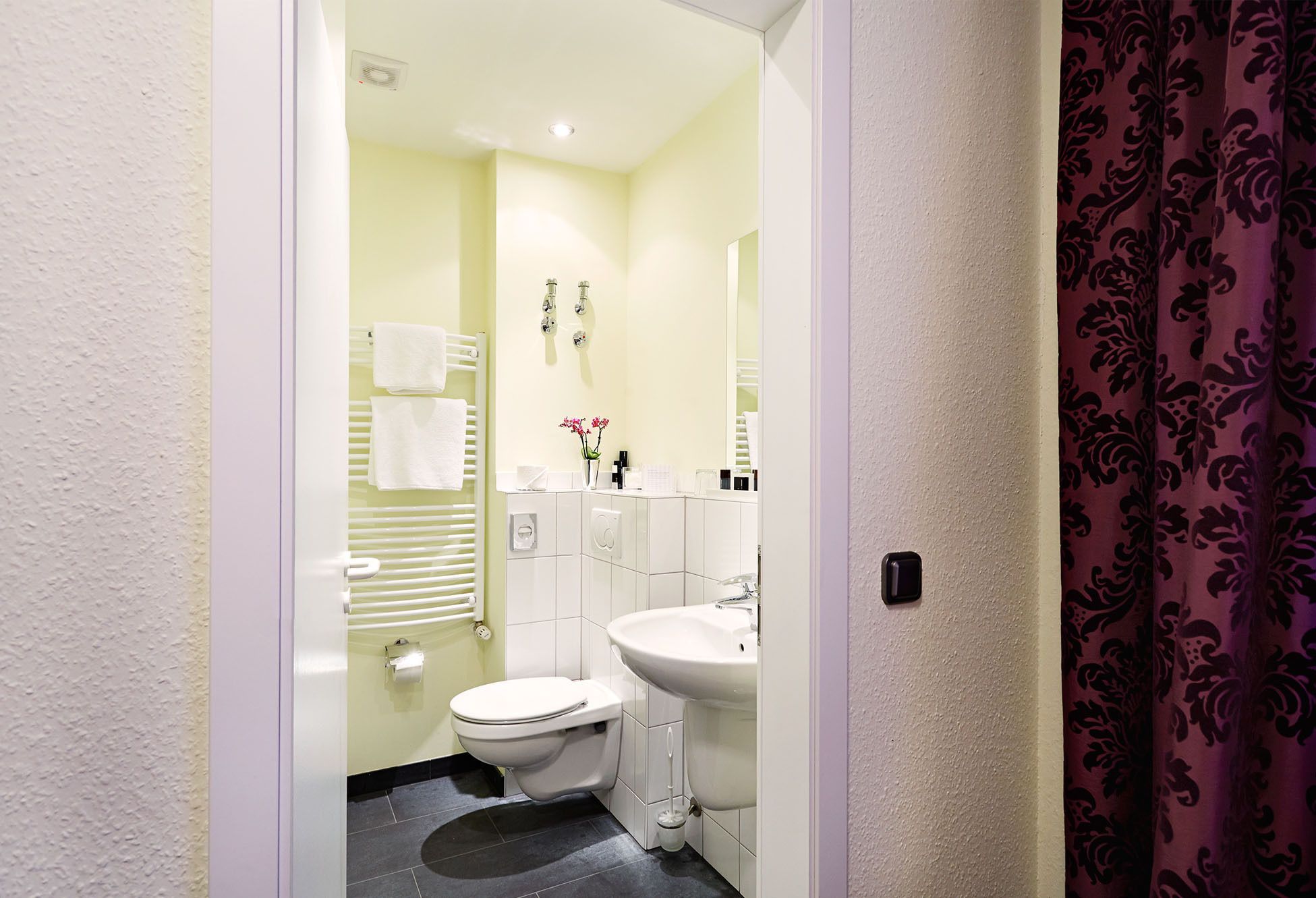 shower, free toiletries, slippers, towels