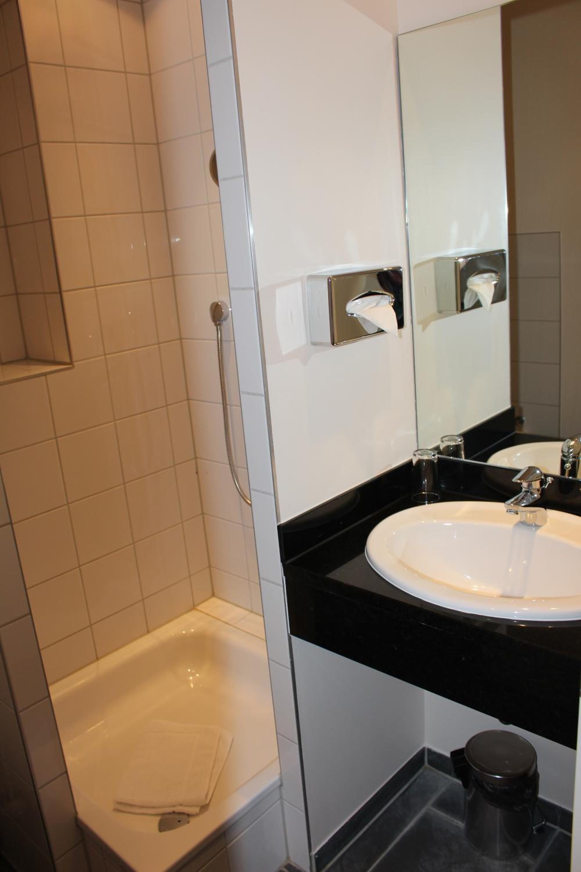 shower, free toiletries, slippers, towels