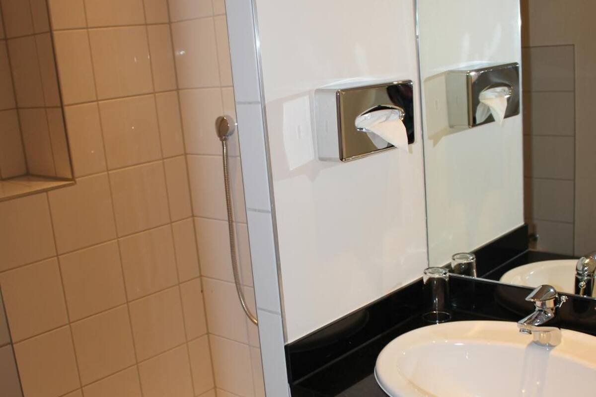 shower, free toiletries, slippers, towels