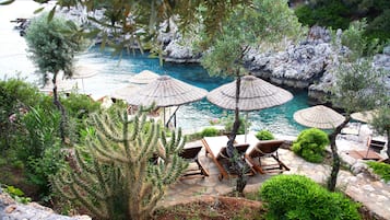 Playa privada, camas de playa gratis, sillas reclinables de playa