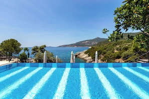 3 outdoor pools, open 8:30 AM to 8:00 PM, pool umbrellas, pool loungers