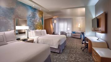 Ropa de cama hipoalergénica y caja de seguridad en la habitación