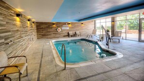 An indoor swimming pool with a stone wall, a blue ceiling, and a sign indicating no diving. - Fairfield Inn & Suites by Marriott Princeton (Princeton)