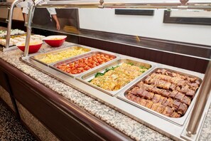 A buffet with various food items including pasta, meats, and salads. - Checkin Flamingo (Torroella de Montgrí)