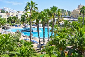 Seasonal outdoor pool, open 11 AM to 8:30 PM, pool umbrellas