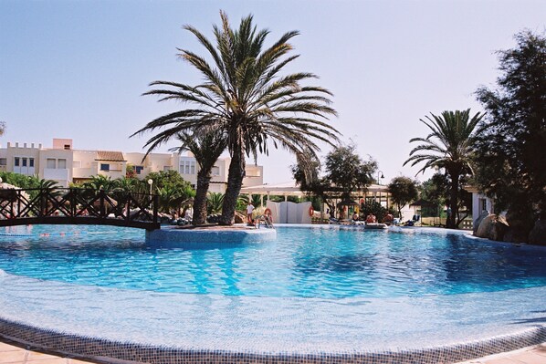 Seasonal outdoor pool, open 11 AM to 8:30 PM, pool umbrellas