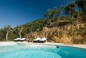 Seasonal outdoor pool, pool loungers