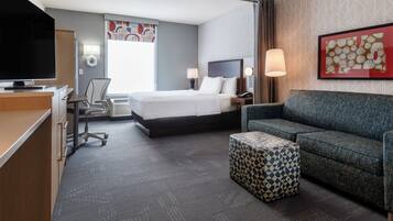 Premium bedding, desk, laptop workspace, blackout drapes