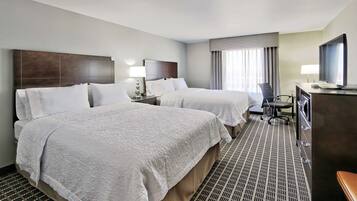 Room, 2 Queen Beds, Non Smoking, Refrigerator & Microwave | Blackout drapes, iron/ironing board, free cribs/infant beds