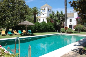 Seasonal outdoor pool, pool loungers