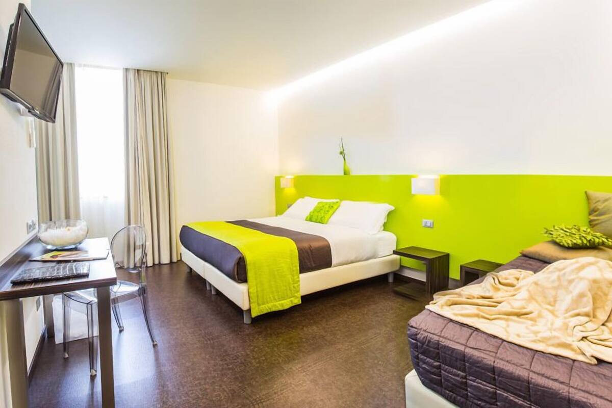 Triple Room | Desk, blackout drapes, WiFi (free), bed sheets