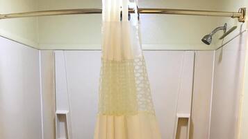 Combined shower/tub, rainfall showerhead, free toiletries, hair dryer