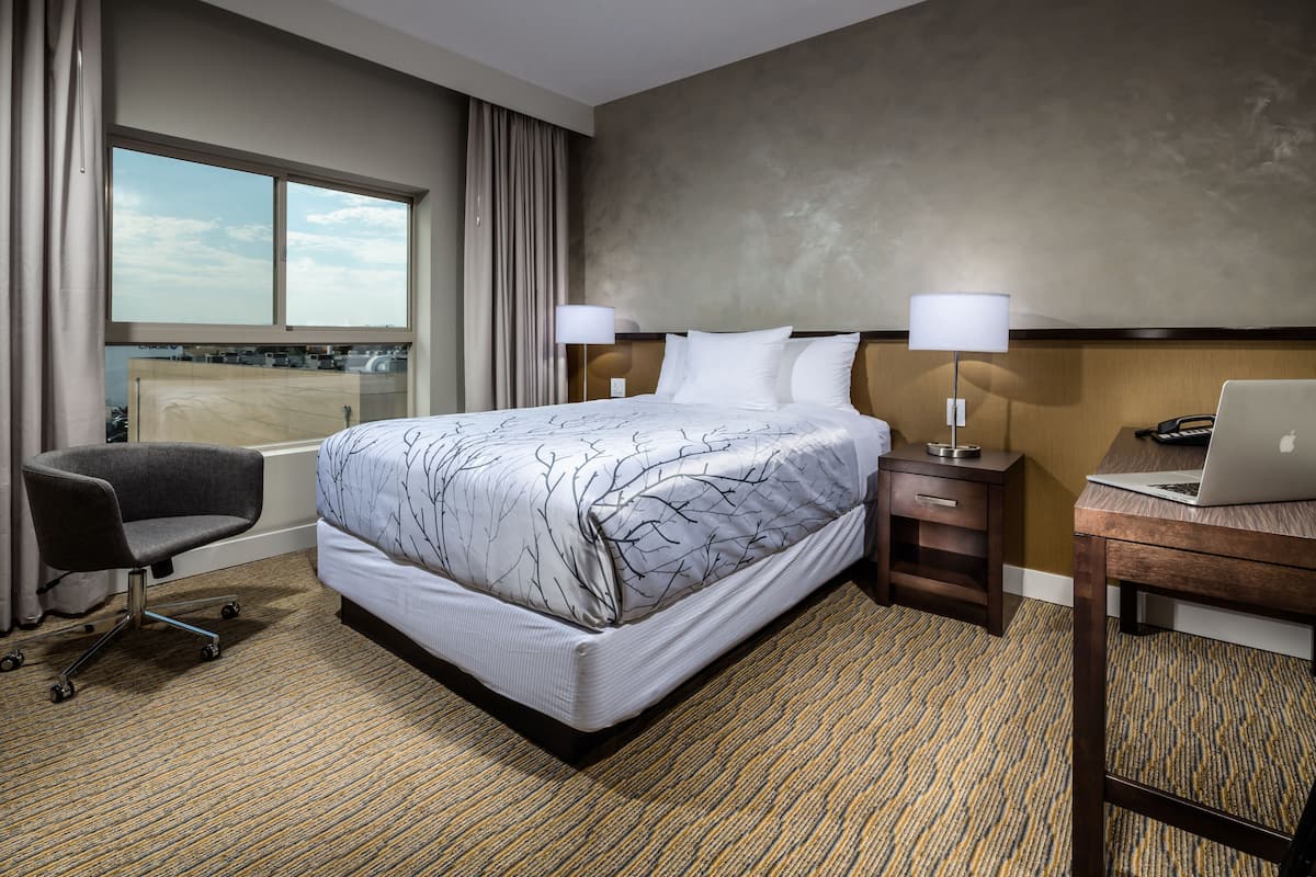 Premium bedding, pillow-top beds, desk, blackout curtains
