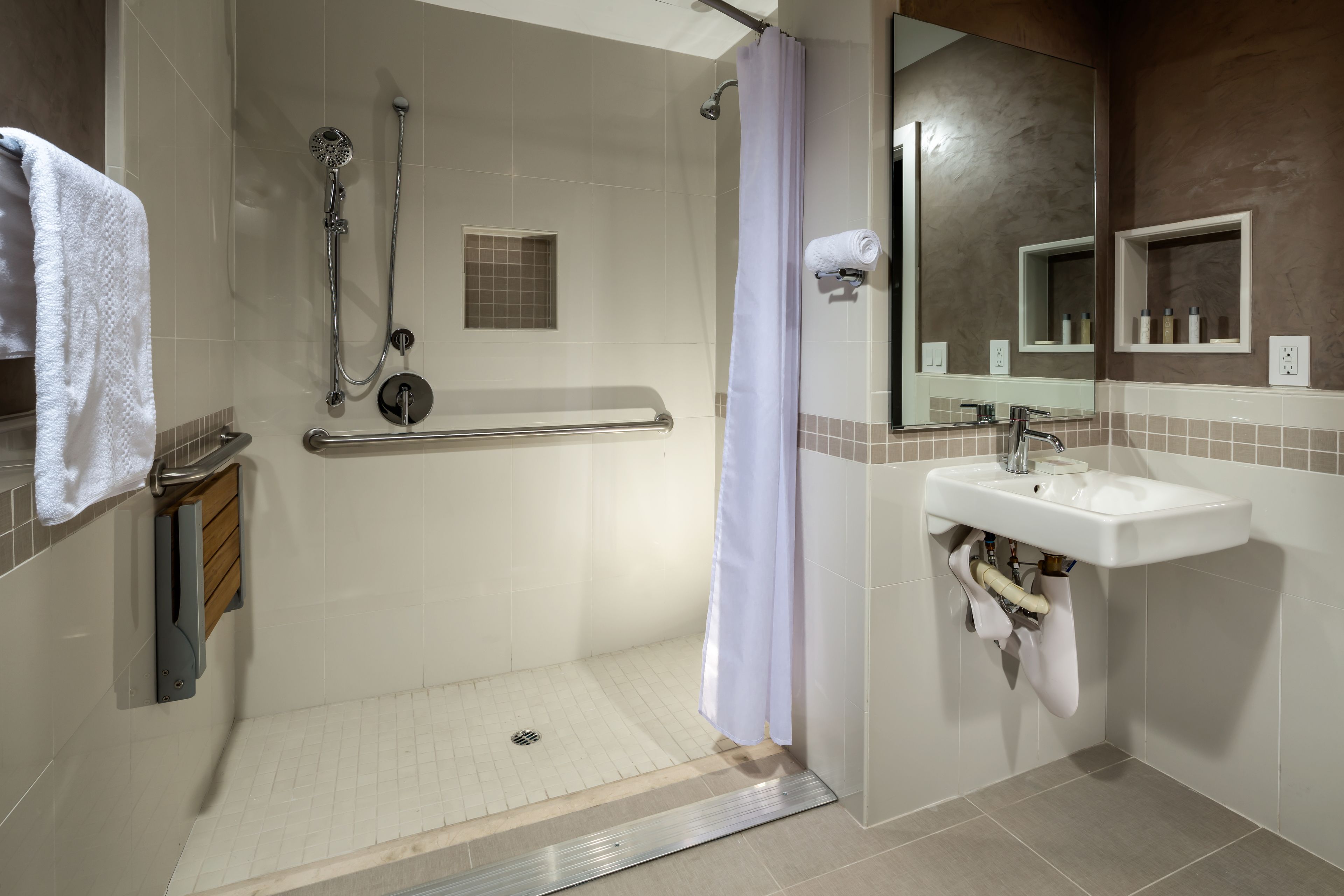 rainfall showerhead, designer toiletries, hair dryer, towels