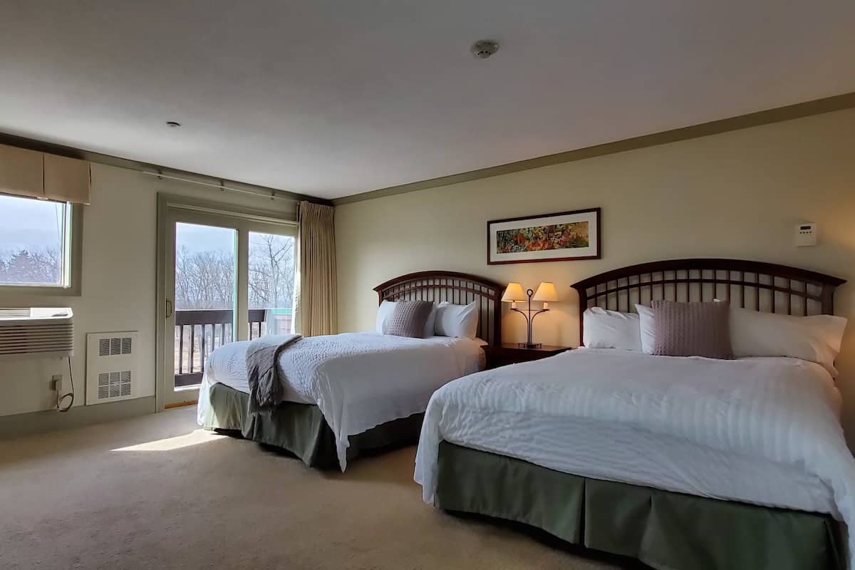 room, 2 queen beds | desk, iron/ironing board, cots/infant beds, rollaway beds