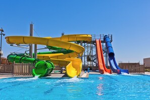 A water park with multiple slides and a pool. - Blue Lagoon Resort (Kos)