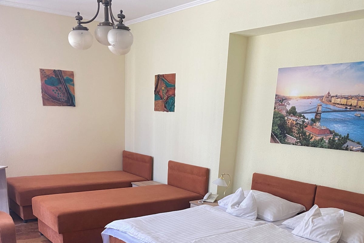 Standard Quadruple Room | Minibar, soundproofing, free WiFi, bed sheets