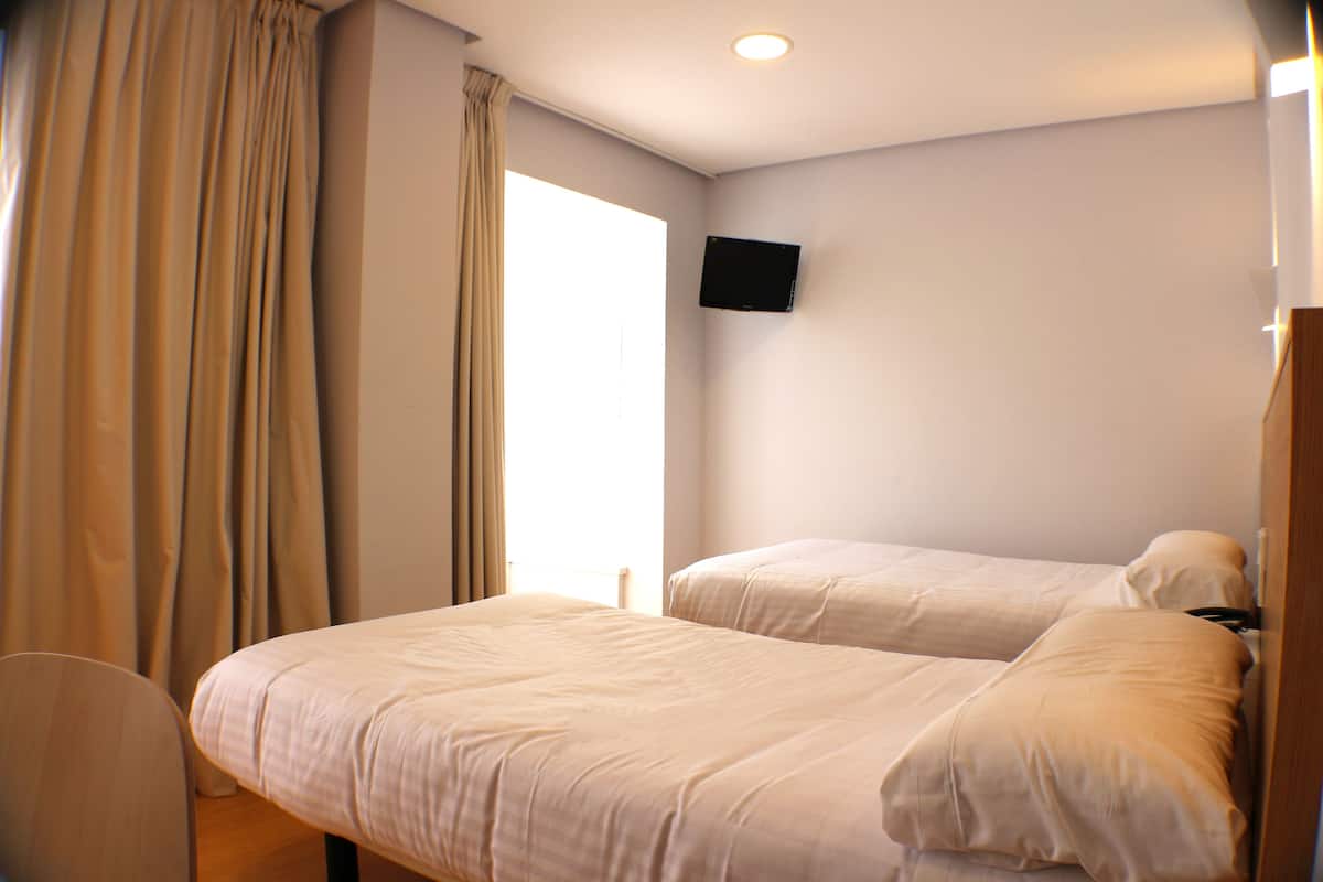 standard double room, 2 single beds | in-room safe, desk, blackout curtains, soundproofing