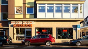A multi-story hotel building with a prominent 'HOTEL' sign on the facade. - Hotel Central Wesseling (Wesseling)