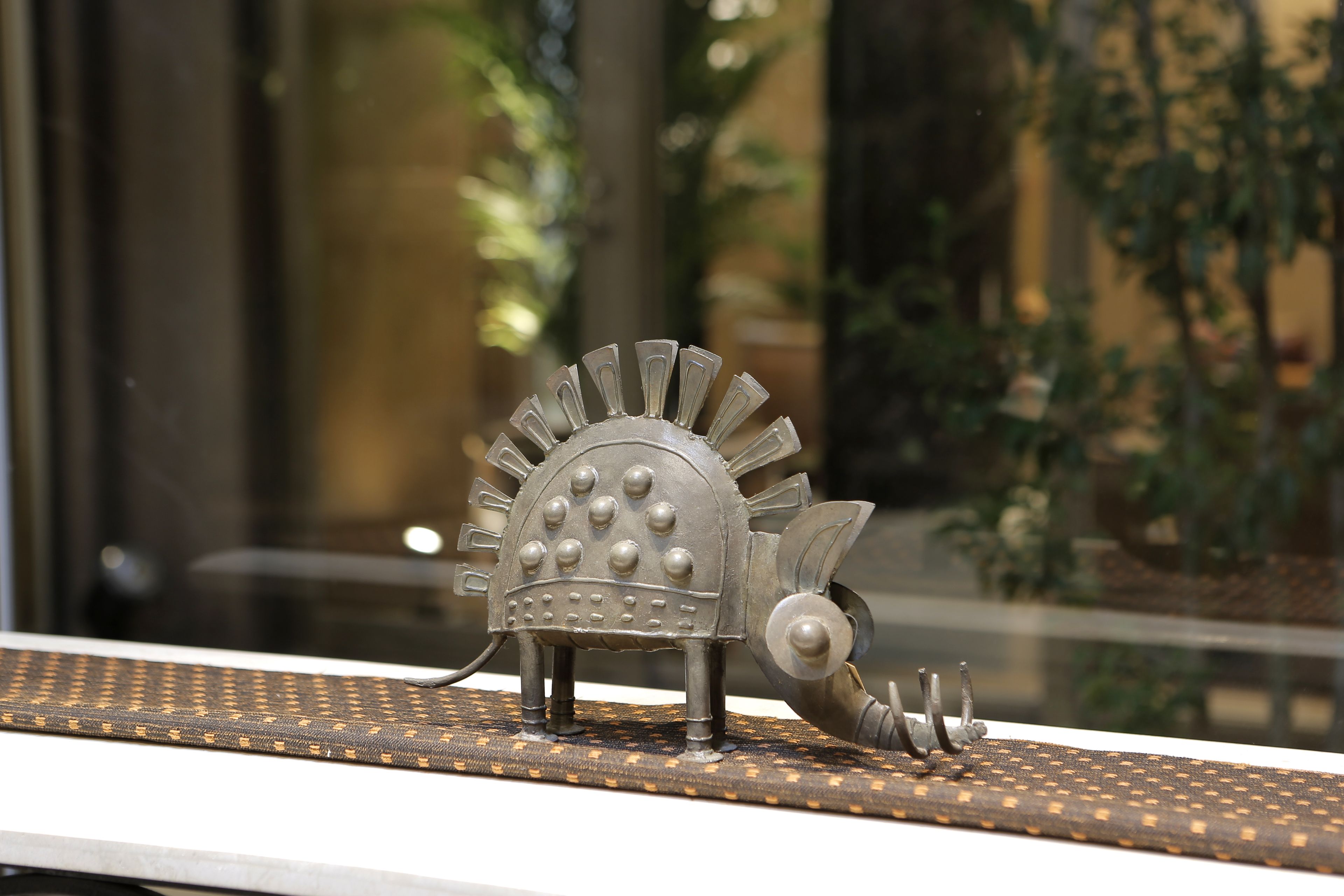 A dinosaur model on a patterned surface.