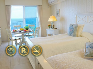 In-room safe, individually decorated, individually furnished, desk - Wisteria Condominium Resort (Motobu)