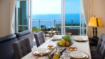 Enjoy a meal in the dining area with a scenic ocean view.