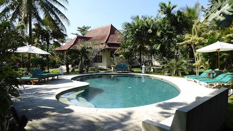 Outdoor pool, sun loungers. Villa Rumah Kita