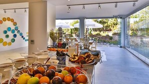 A breakfast buffet with various fruits, pastries, and beverages. - Arnna Hotel (Kas)