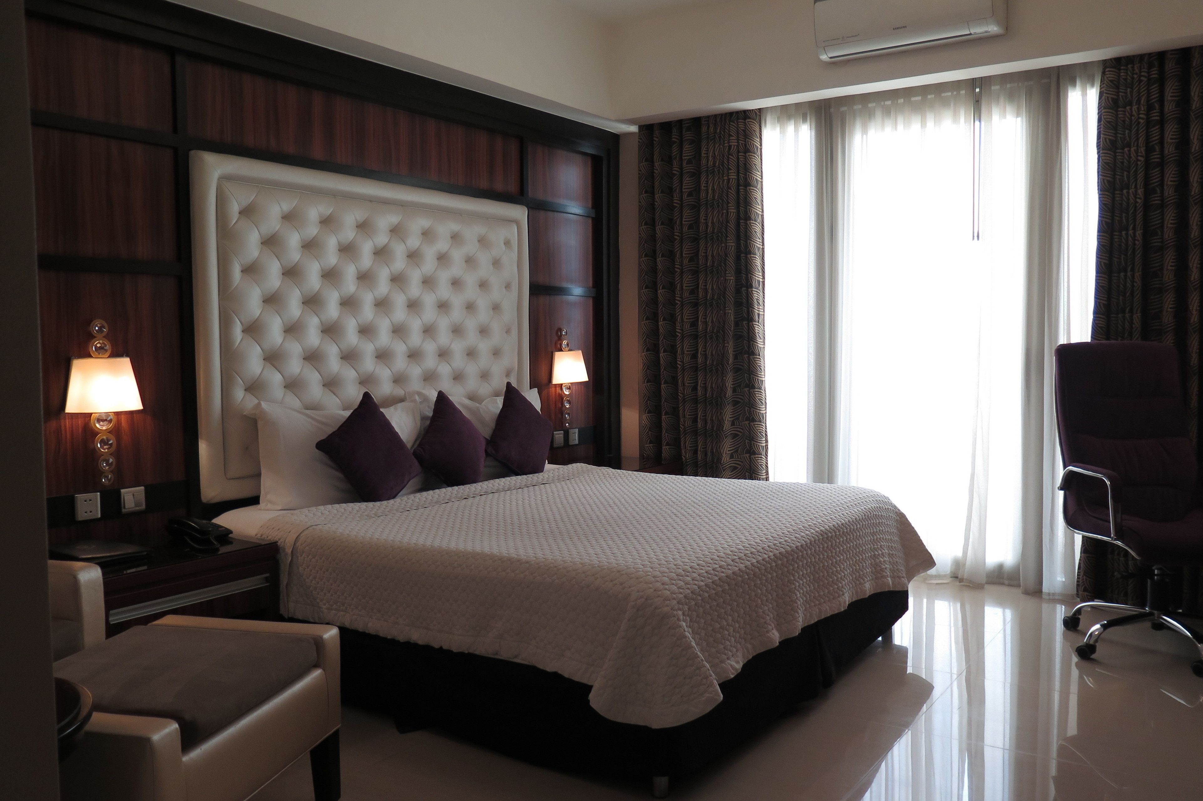 Habitación Deluxe | Ropa de cama de alta calidad y minibar 