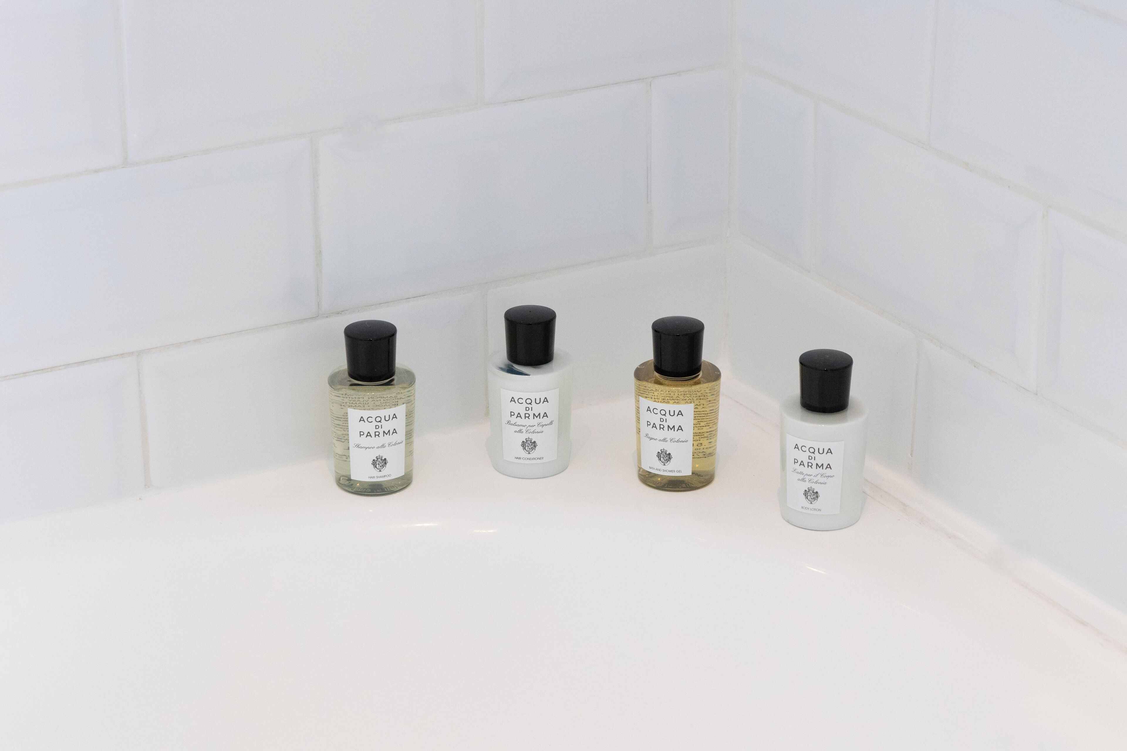 designer toiletries, hair dryer, bathrobes, slippers