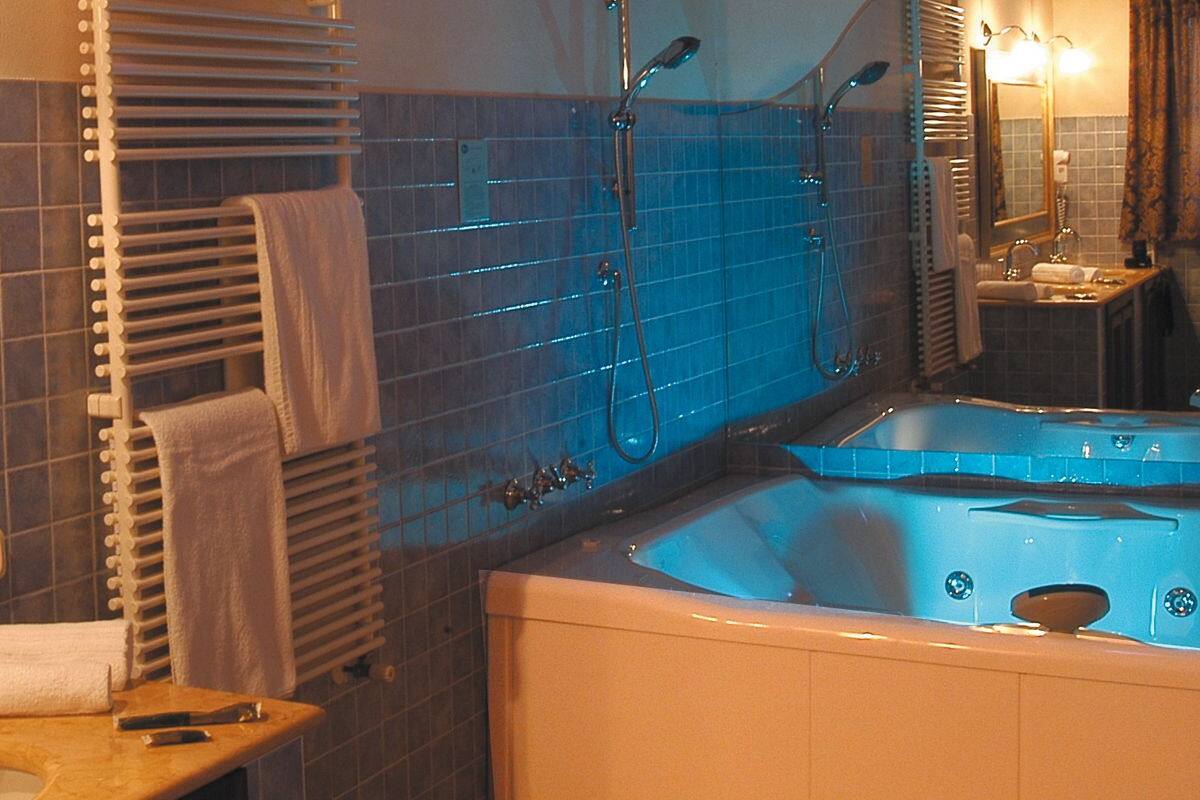 suite, jetted tub | bathroom | combined shower/bathtub, jetted bath, slippers, bidet