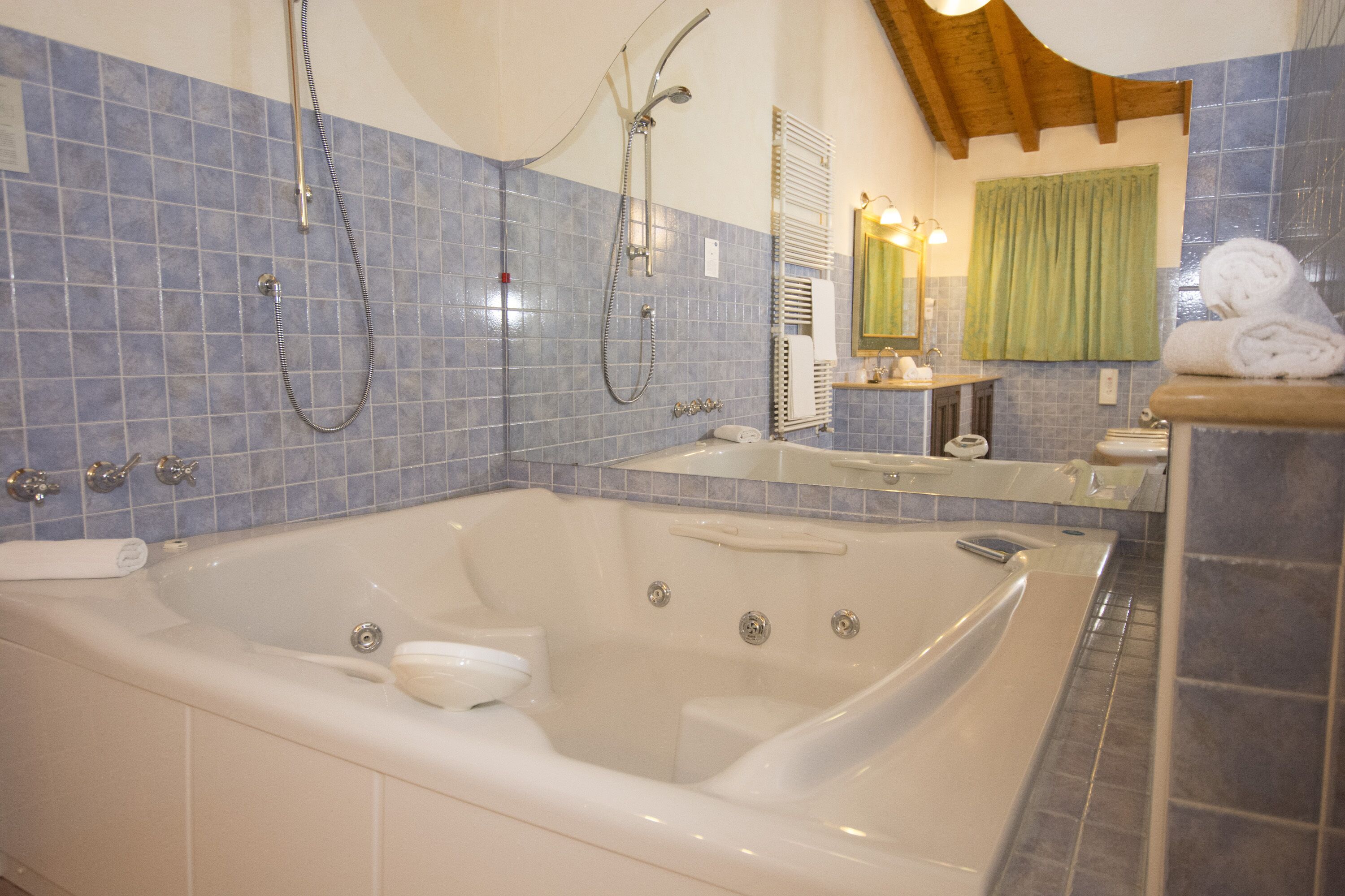 suite, jetted tub | bathroom | combined shower/bathtub, jetted bath, slippers, bidet