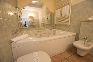 Double Room | Bathroom | Combined shower/bathtub, jetted bath, slippers, bidet