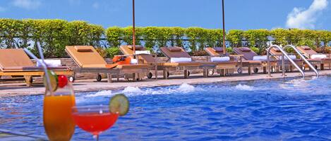 Outdoor pool, pool umbrellas, pool loungers