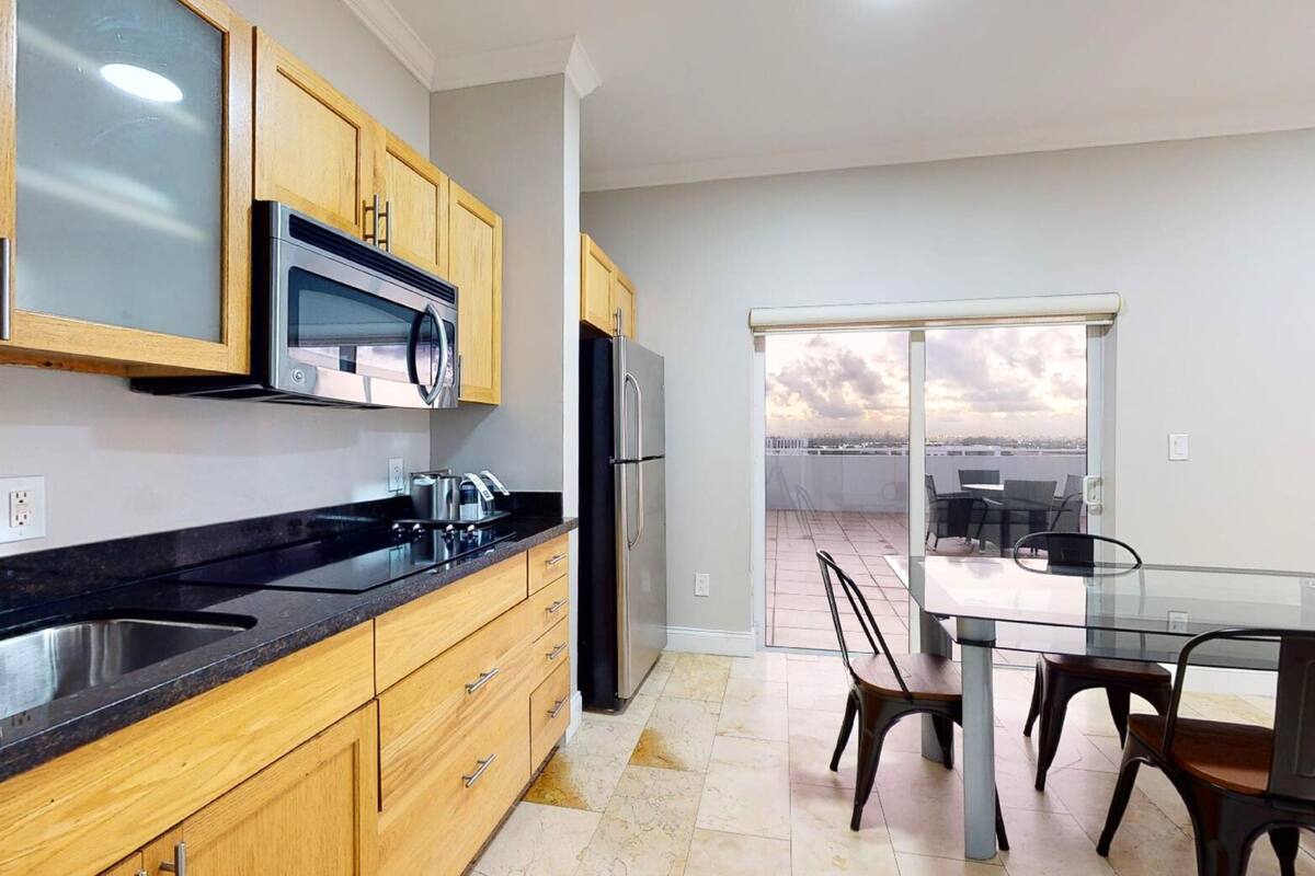 family suite, multiple beds | private kitchen | microwave, coffee/tea maker