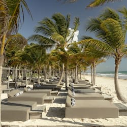 On the beach, white sand, free beach cabanas, beach towels