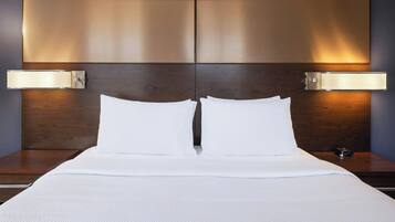 Premium bedding, down comforters, memory foam beds, in-room safe