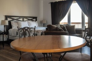 Romantic Cottage, Ocean View | Living room | Flat-screen TV - Heron's Nest Cottages (Charlo)