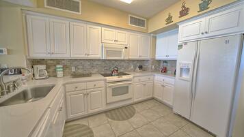Condo, 2 Bedrooms | Private kitchen | Full-sized fridge, microwave, oven, stovetop