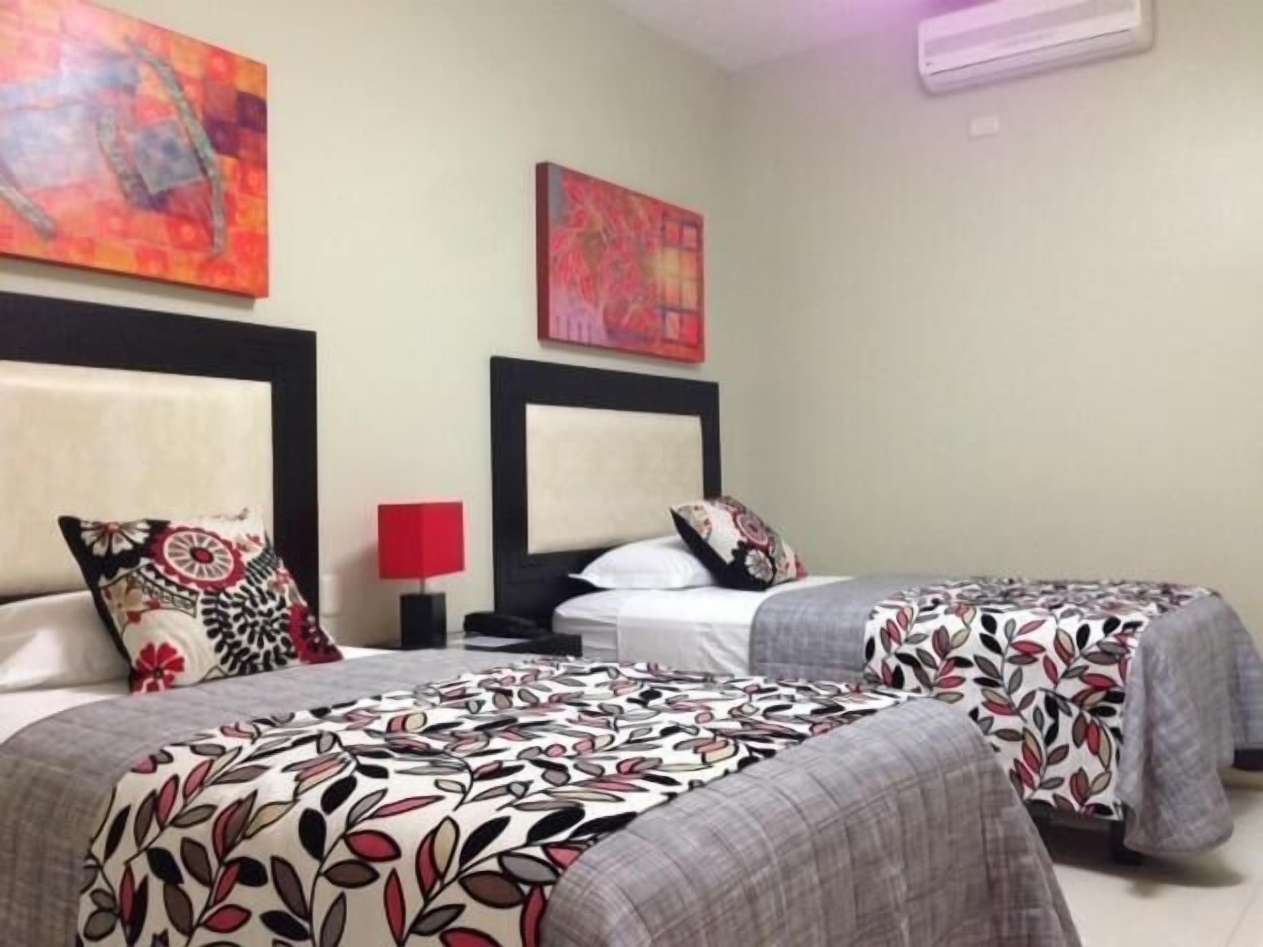 twin room | minibar, in-room safe, desk, blackout curtains