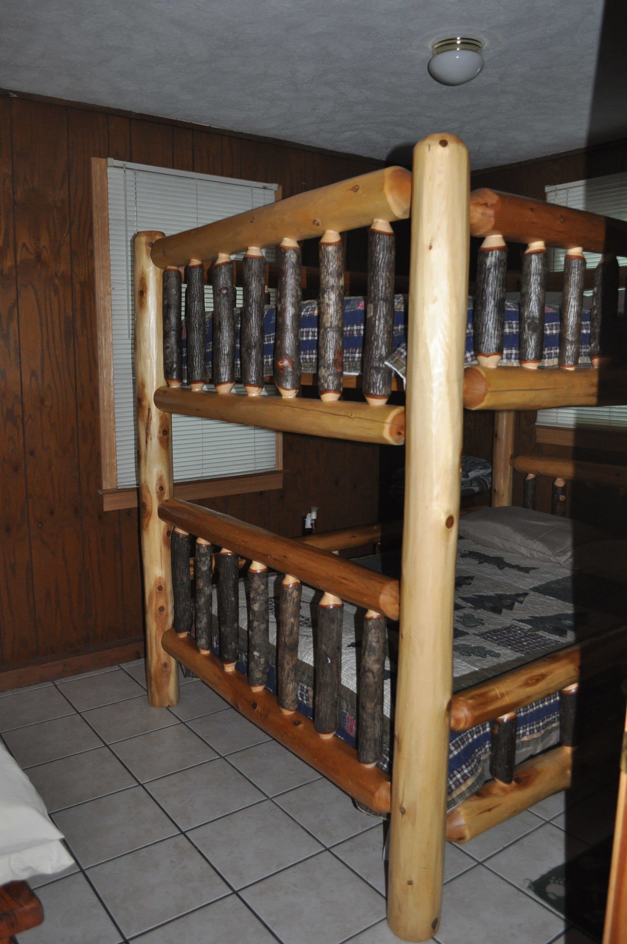 A bunk bed with wooden slats and a metal frame.