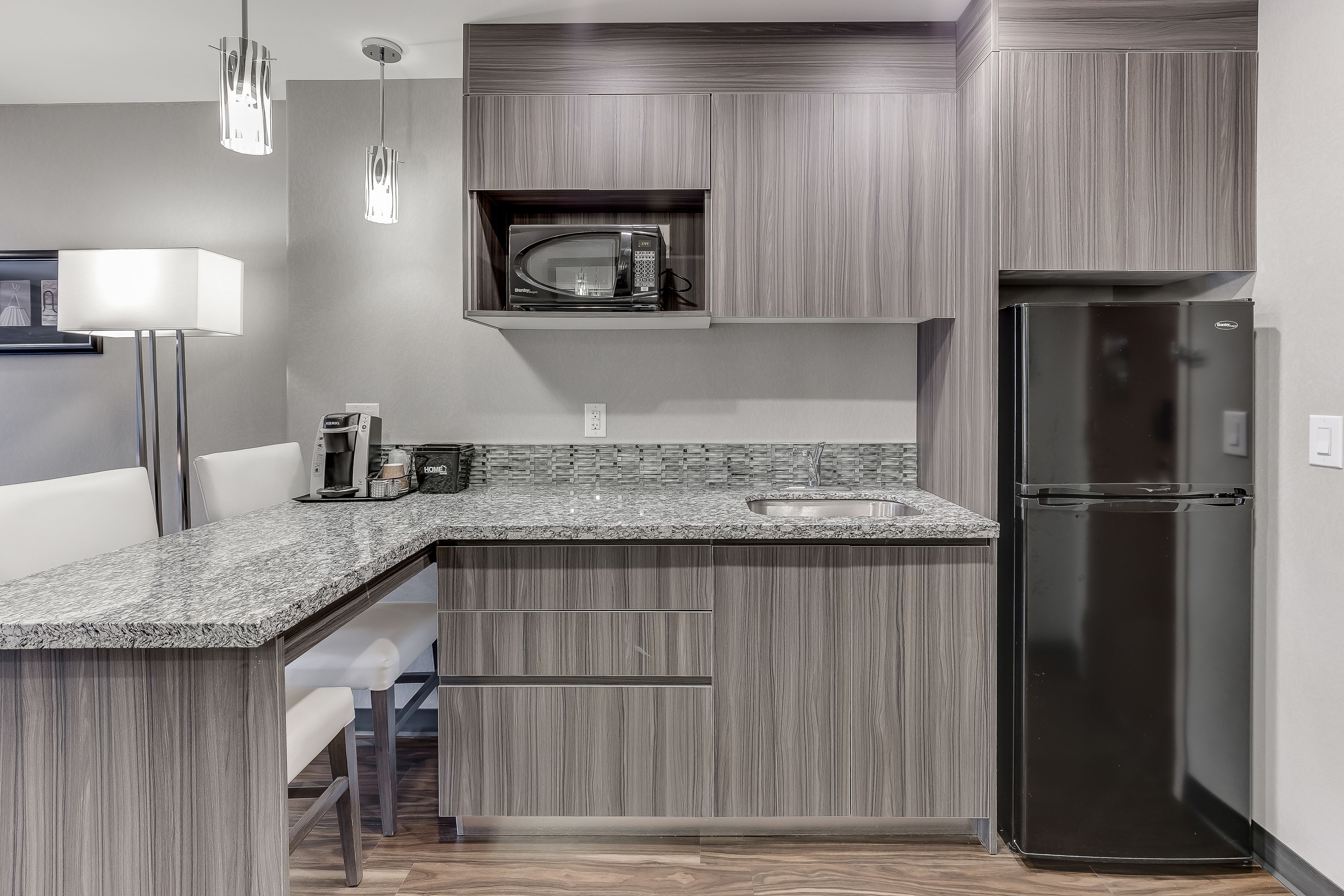 standard suite, 2 queen beds, kitchenette | 1 bedroom, premium bedding, desk, laptop workspace