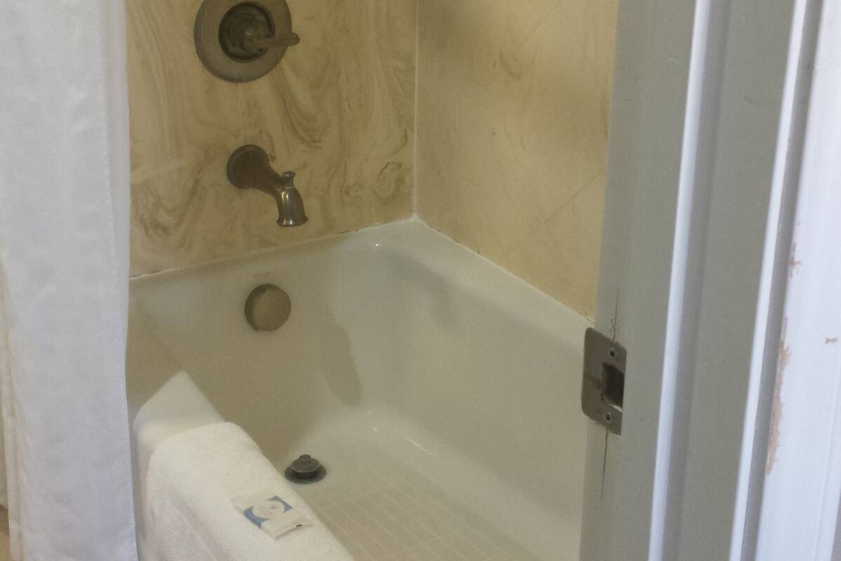 room, 2 queen beds | bathroom | combined shower/bathtub, free toiletries, hair dryer, towels