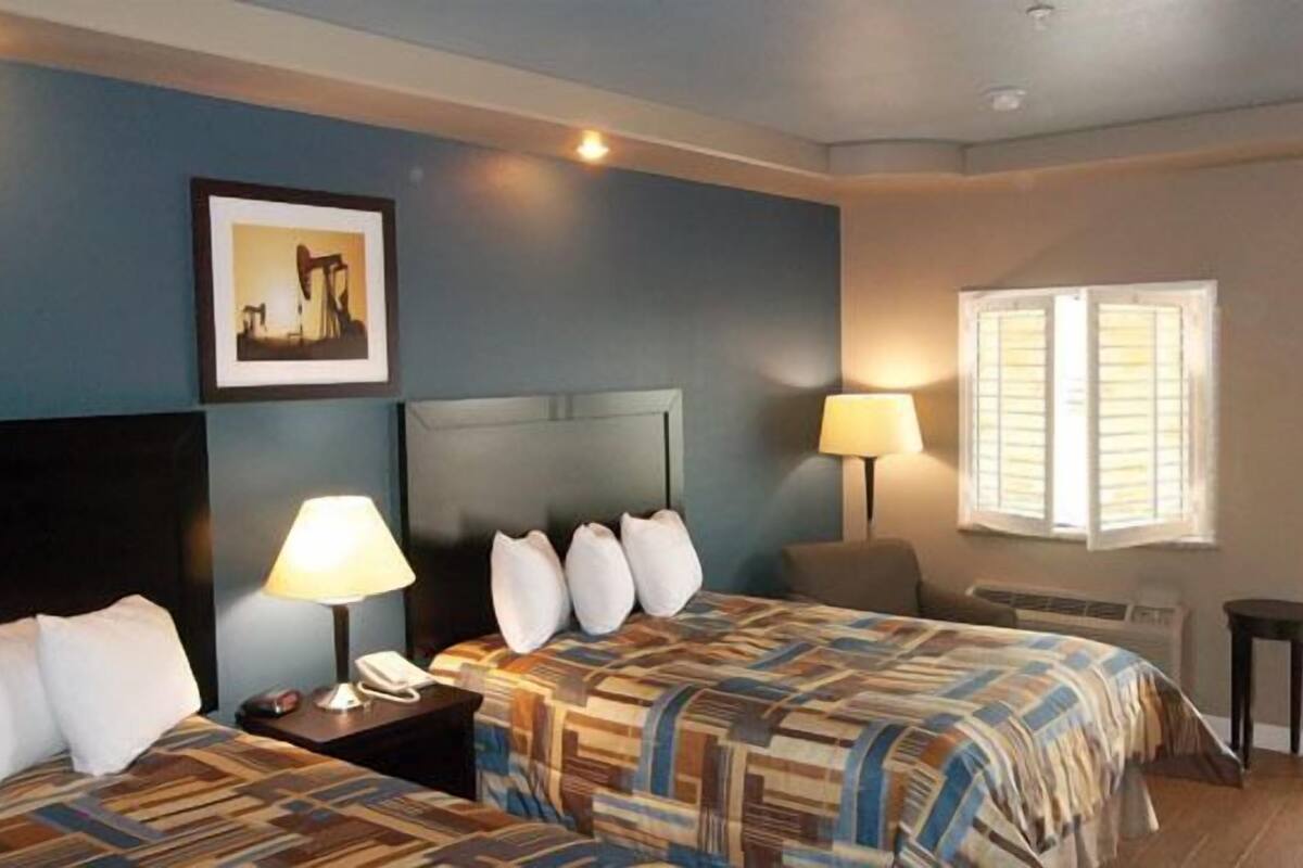 room, 2 queen beds | 1 bedroom, desk, iron/ironing board, free wired internet