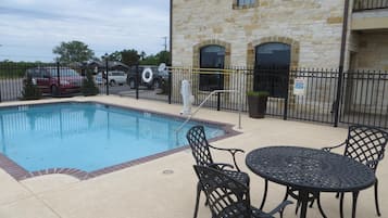 Seasonal outdoor pool, open 10 AM to 10:00 PM, pool loungers