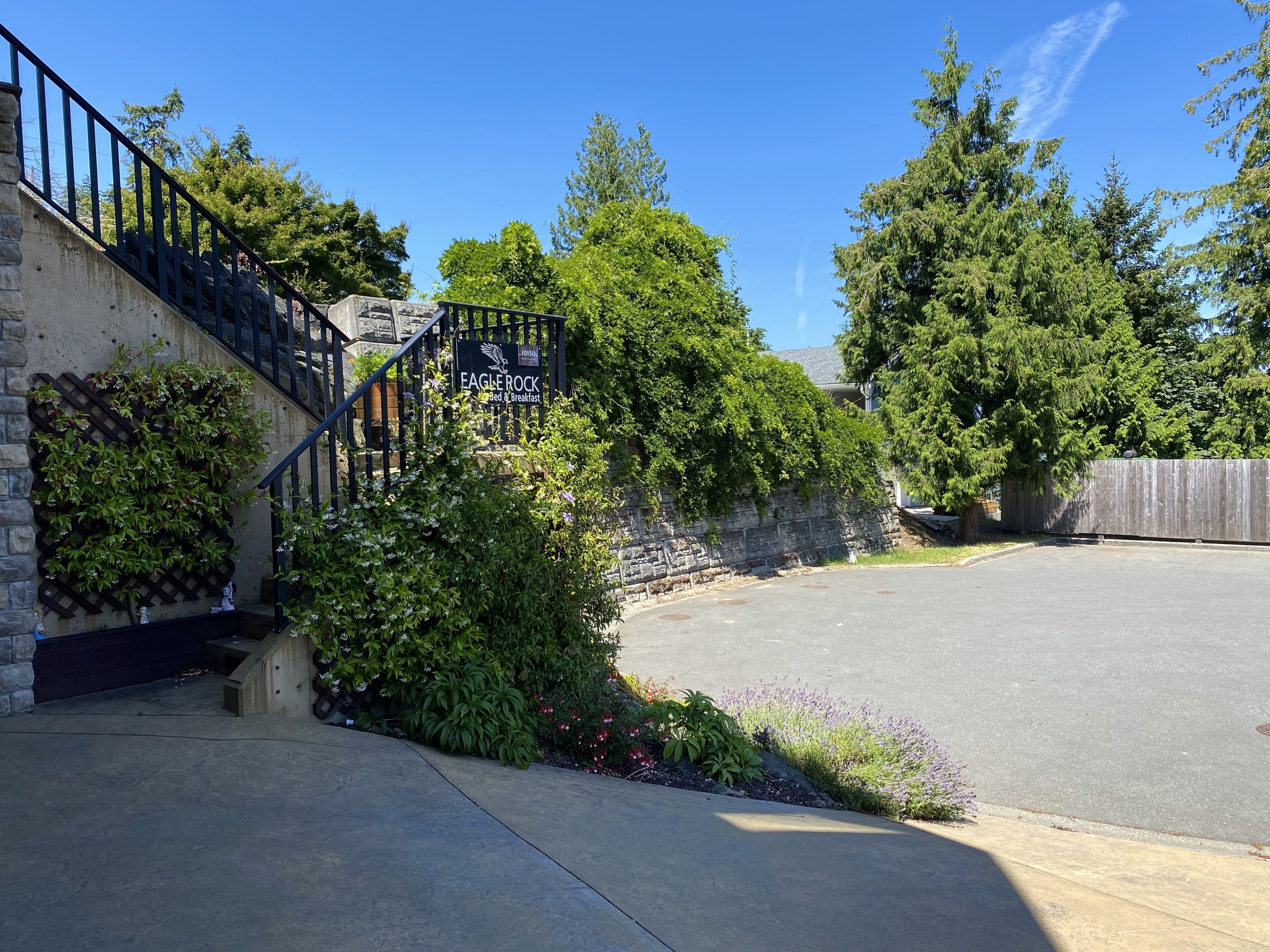 A stone staircase leading to a building with a sign reading "Eagle Rock".
