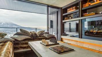 Luxury Suite, 3 Bedrooms | Living area | 43-inch flat-screen TV with satellite channels, TV, fireplace